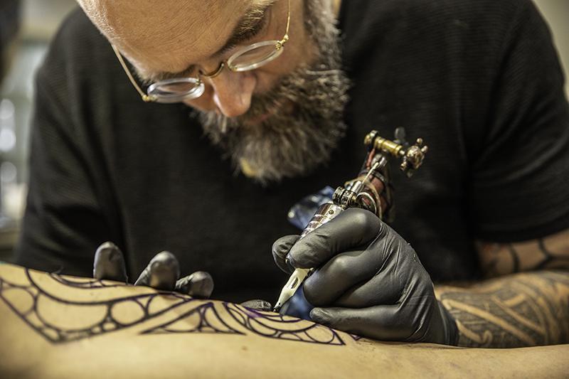 tattoo artist close up